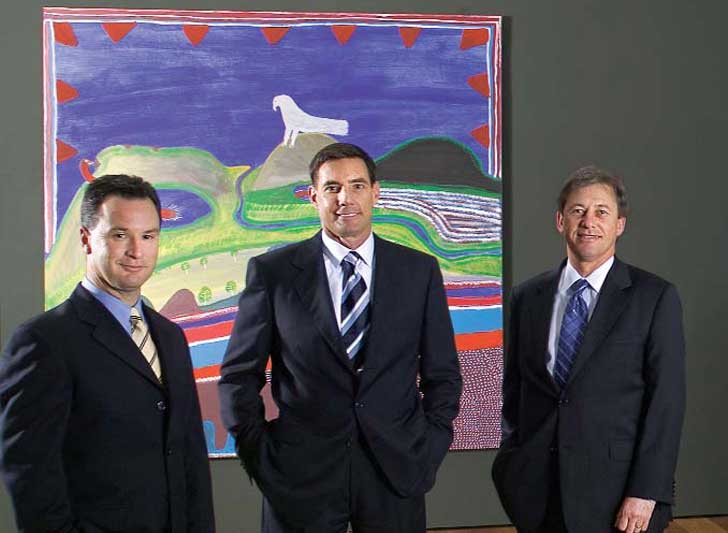 Brian Kruger, Kirby Adams, Iain Cummin, pictured in the newly named BlueScope Steel Indigenous Art Galleries at the National Gallery of Victoria in Melbourne. 